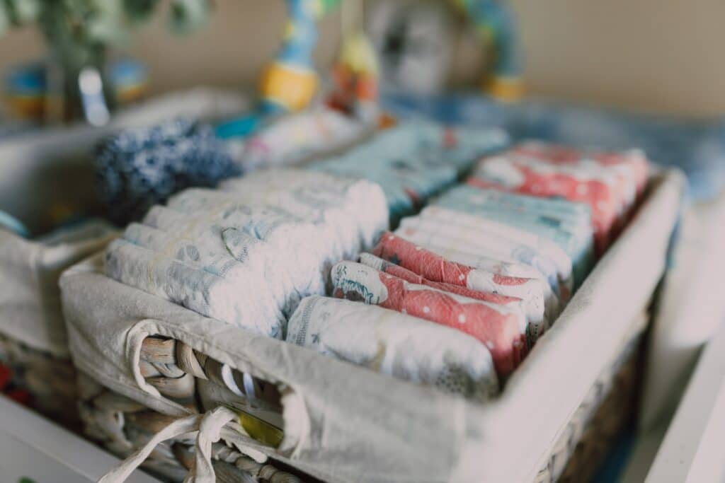 Diapers folded in cloth basket
