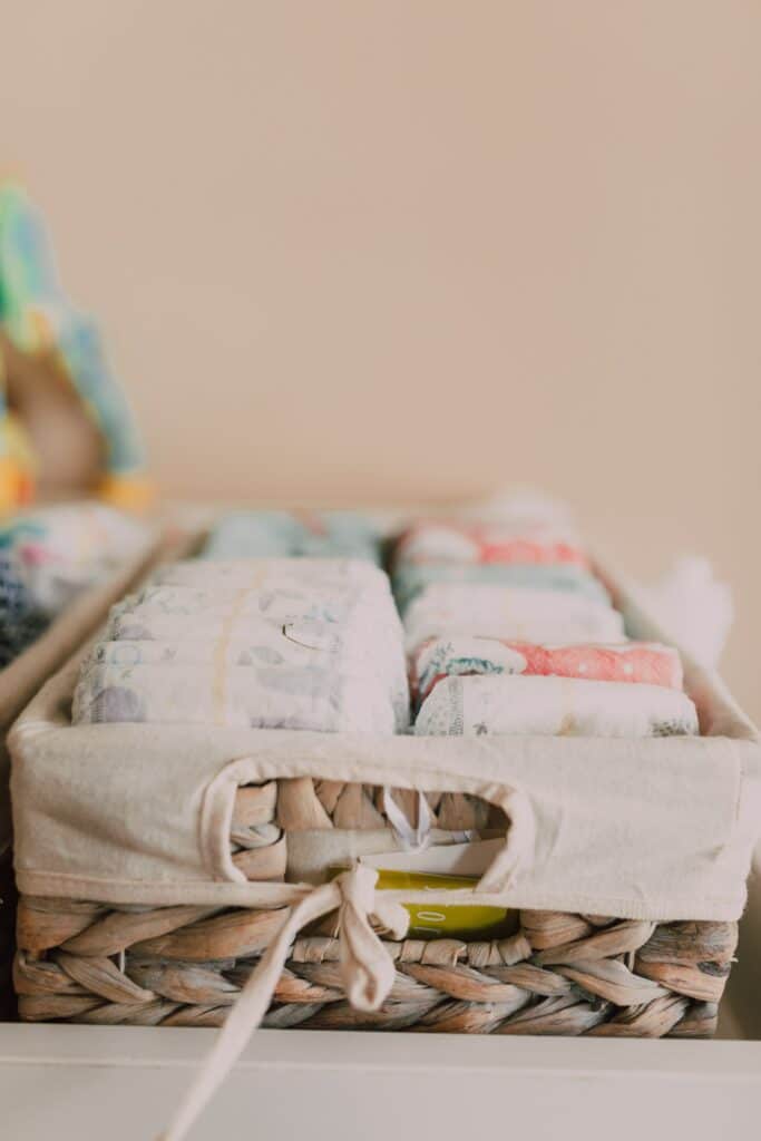 Basket of disposable baby diapers