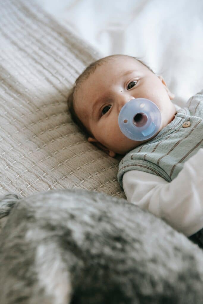 Baby using an Avent Soothie pacifier