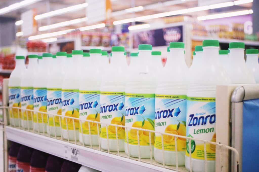 Row of bleach bottles on a store shelf