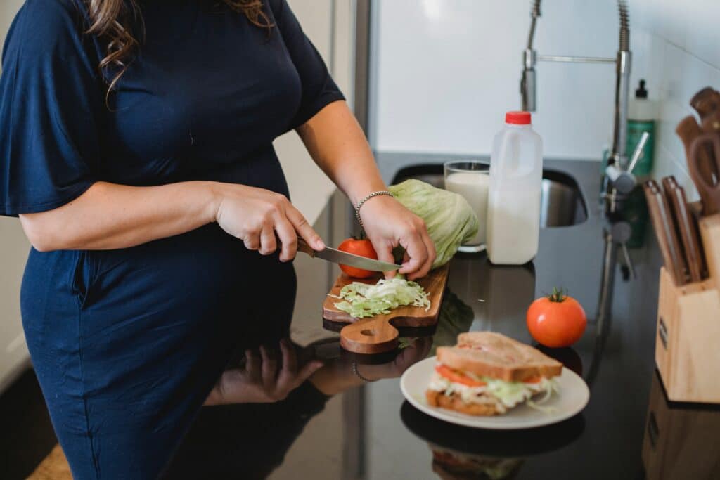 Pregnant woman preparing lunch