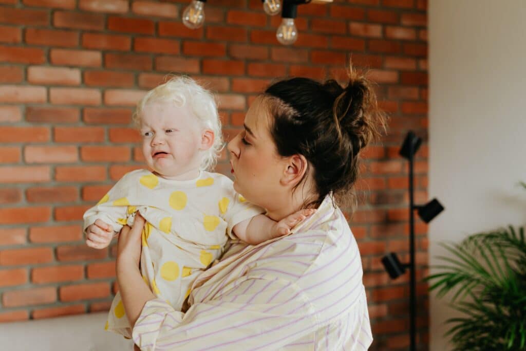 Mom holding fussy baby