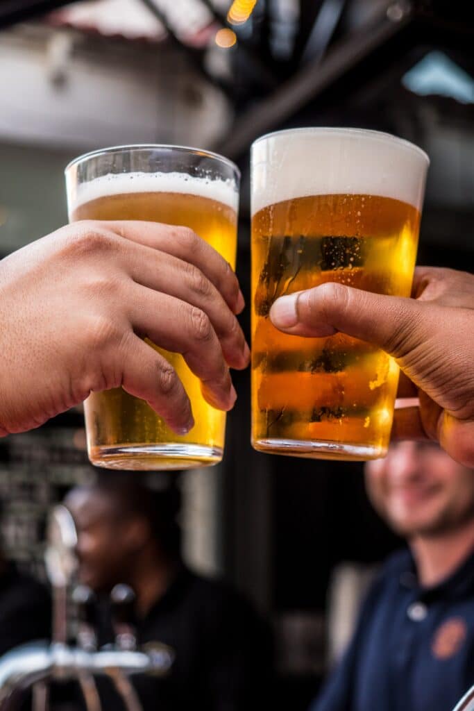 Men cheersing at a brewery