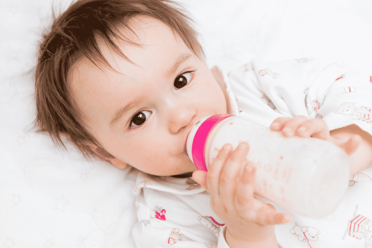 Baby drinking milk with protein allergy