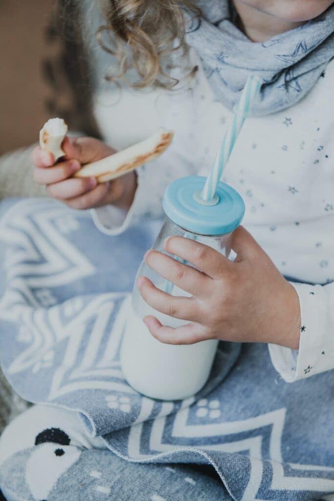 Child drinking milk from a bottle