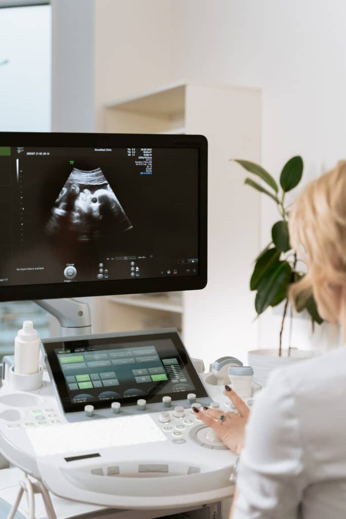 A technician operates an ultrasound machine