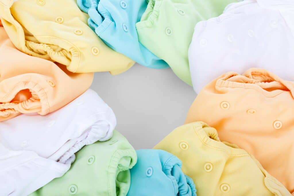 Cloth diapers come with their own issues with a baby boy peeing out