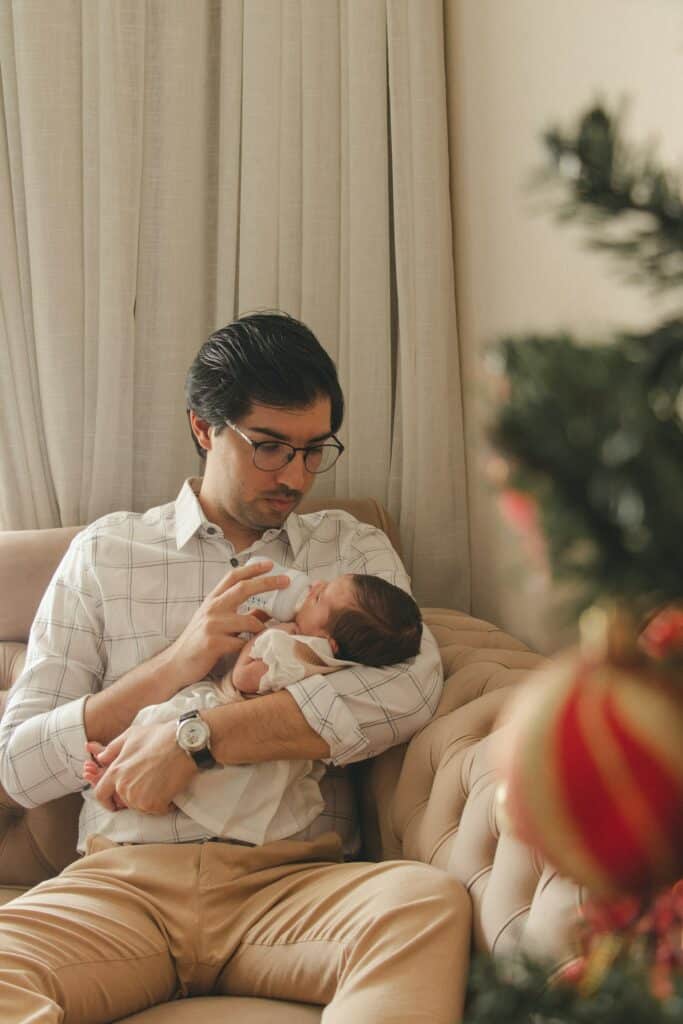 To reduce the times that your baby cries when dad holds her, have Dad take over some feeding duties