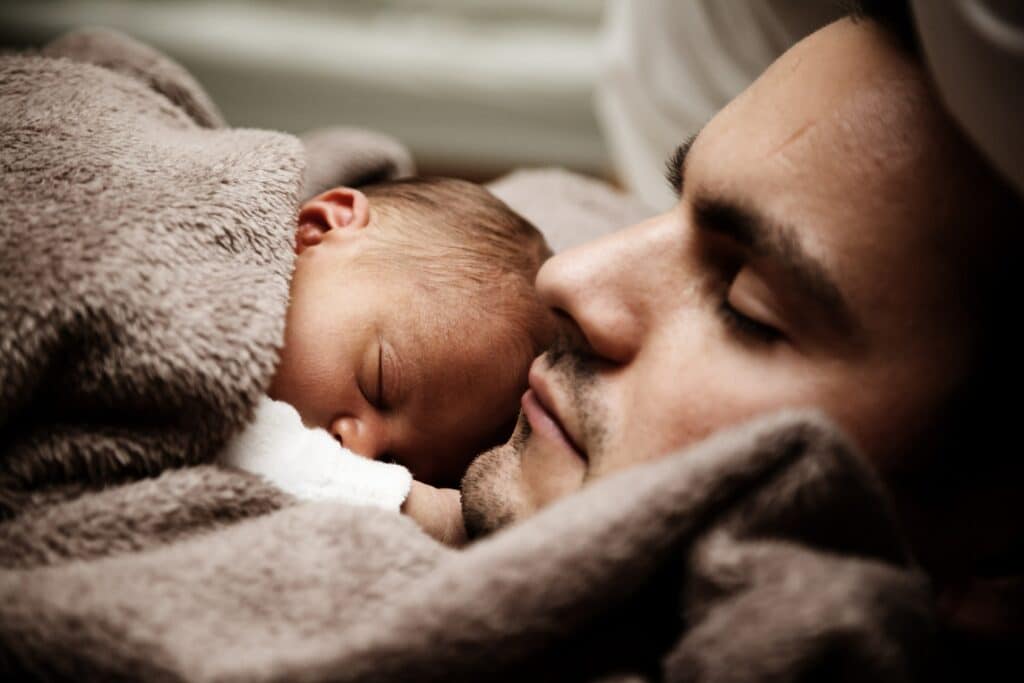 If your baby cries when dad holds her, try skin-to-skin and baby-wearing to promote a close bond