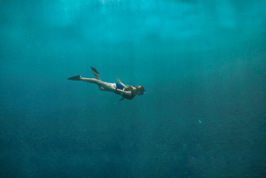 woman snorkeling under water