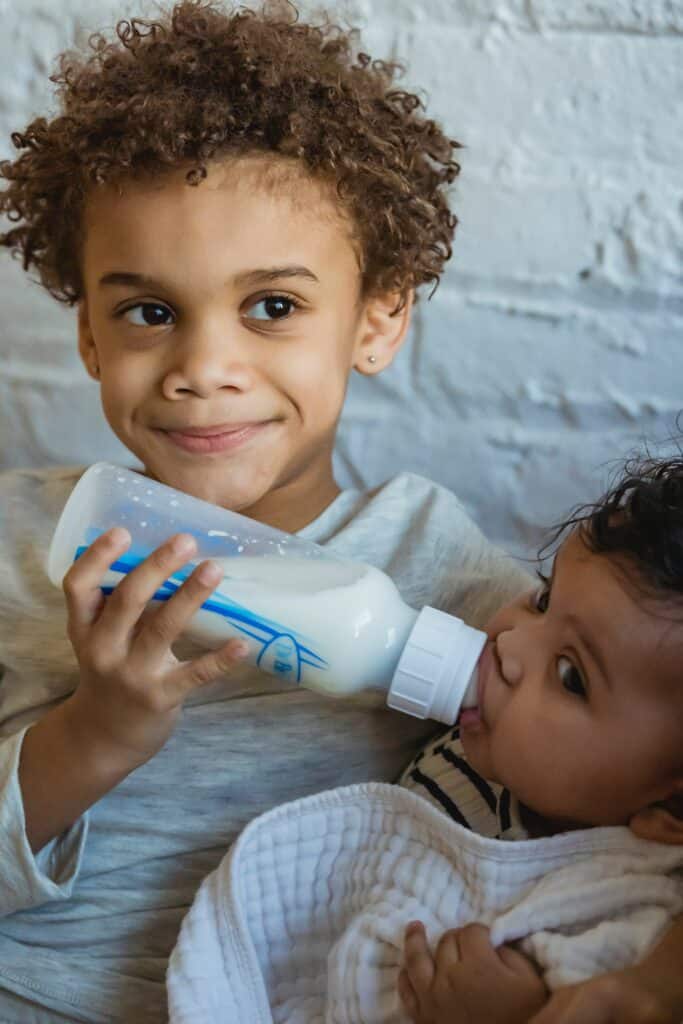 sibling feeding baby milk