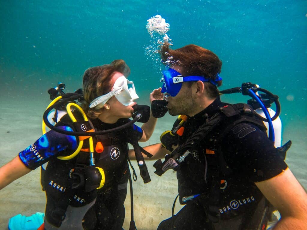woman and man scuba diving