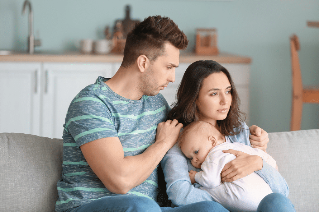 Husband helping his wife with postpartum depression
